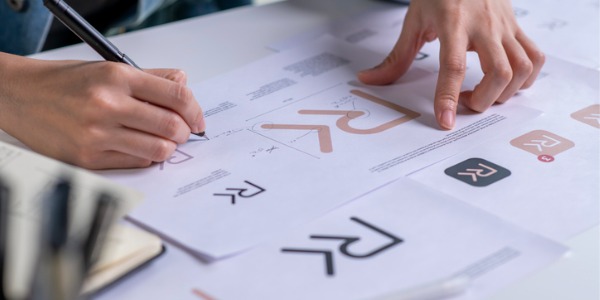 A brand designer working on developing a logo.