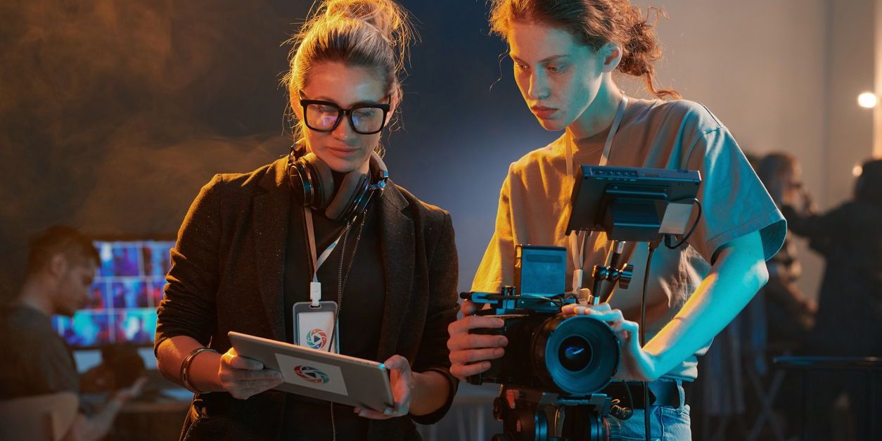 A television director determining camera angles with the cameraman.