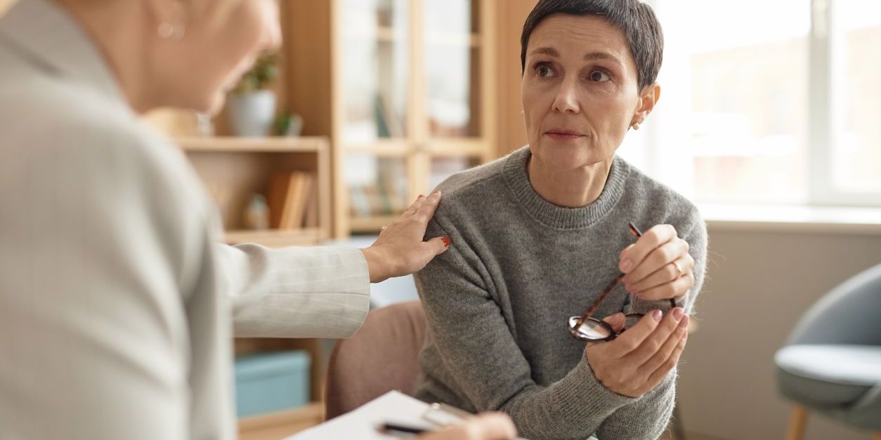 A detox counselor helping her client with staying committed to recovery.