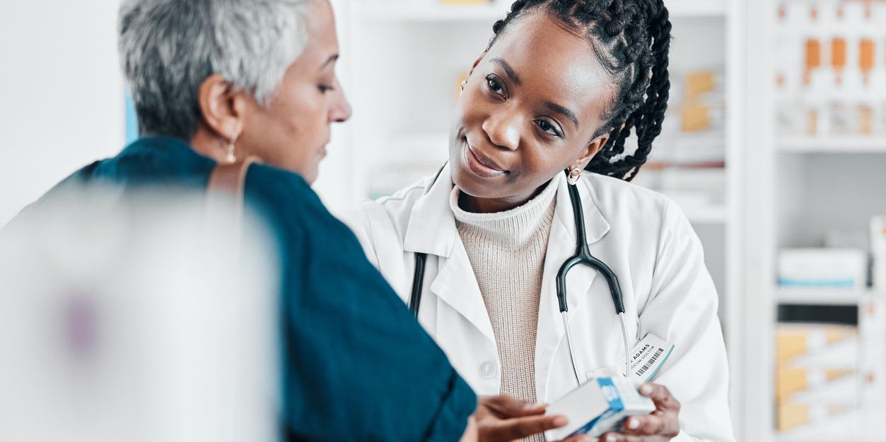 An older woman consulting with a geriatric pharmacist.