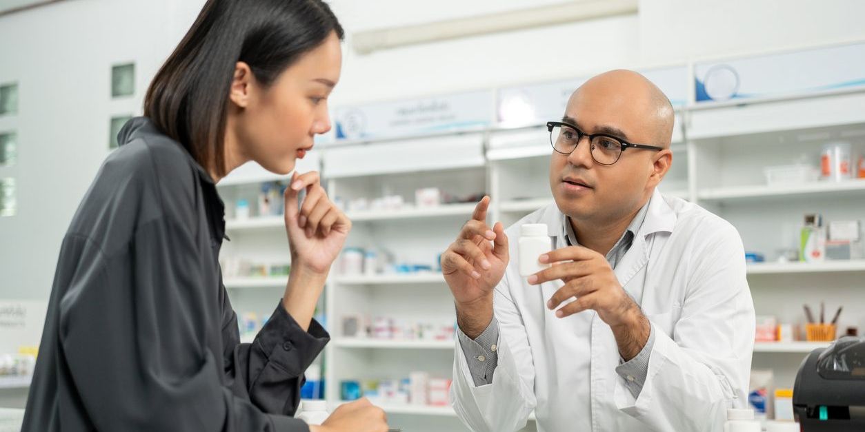 A consultant pharmacist reviewing a patient's medication profile.