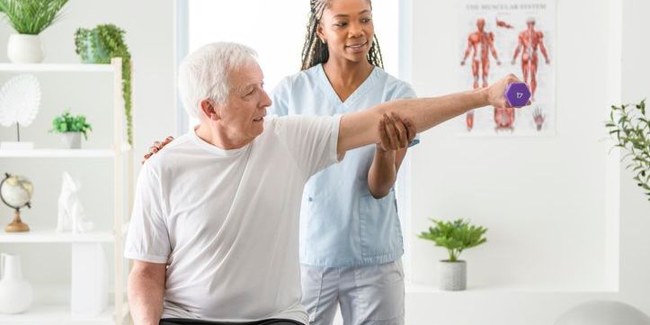 An orthopedic physiotherapist working with a patient.