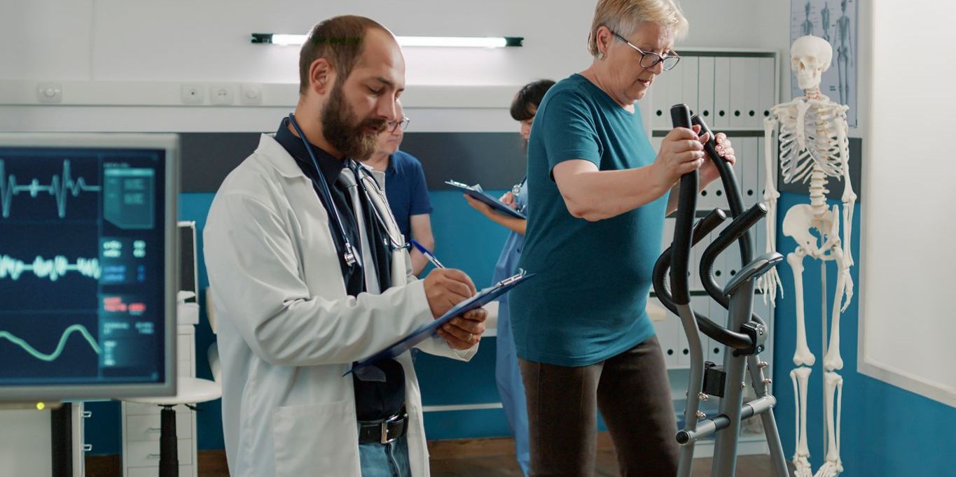 A cardiorespiratory physiotherapist working with a patient.