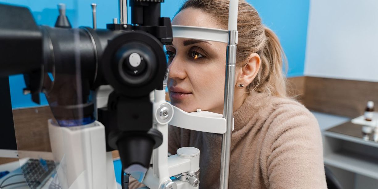 A low vision optometrist checking a patient's eyesight.