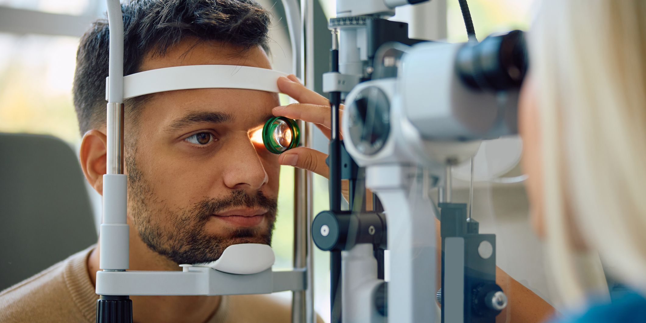 An ocular disease optometrist checking a patient's eyes.