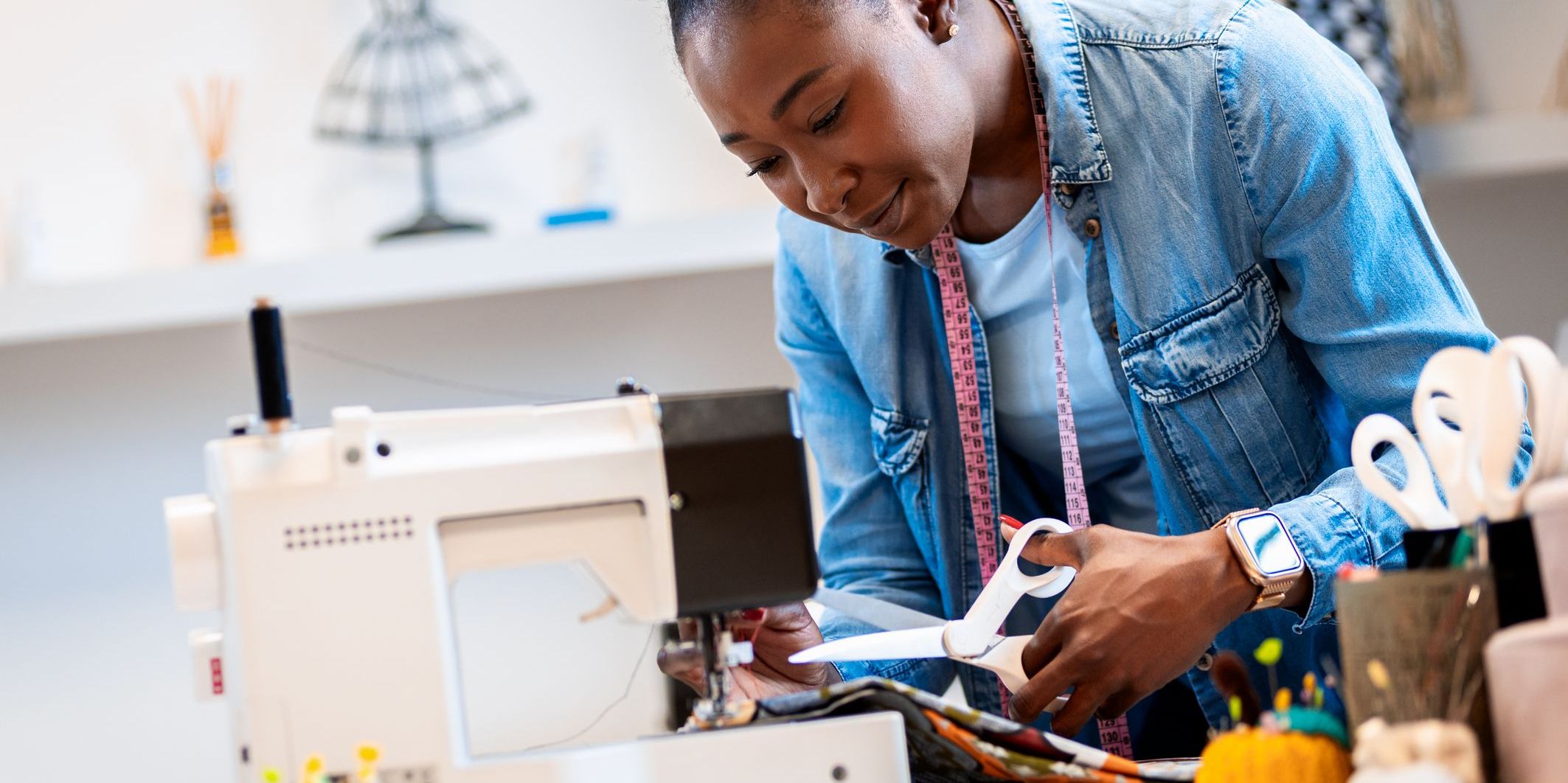 An alteration seamstress altering a customer's clothing.