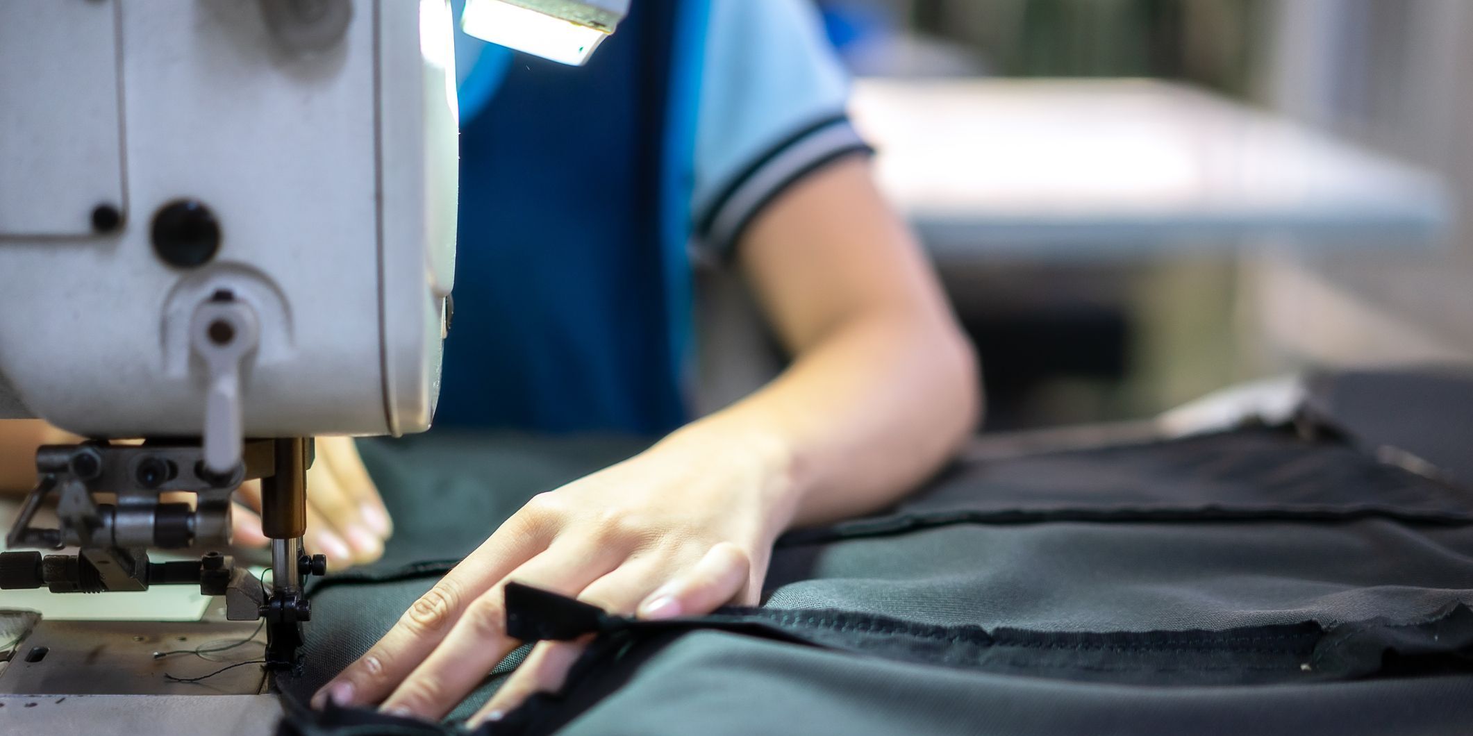 A sewer using an industrial sewing machine.