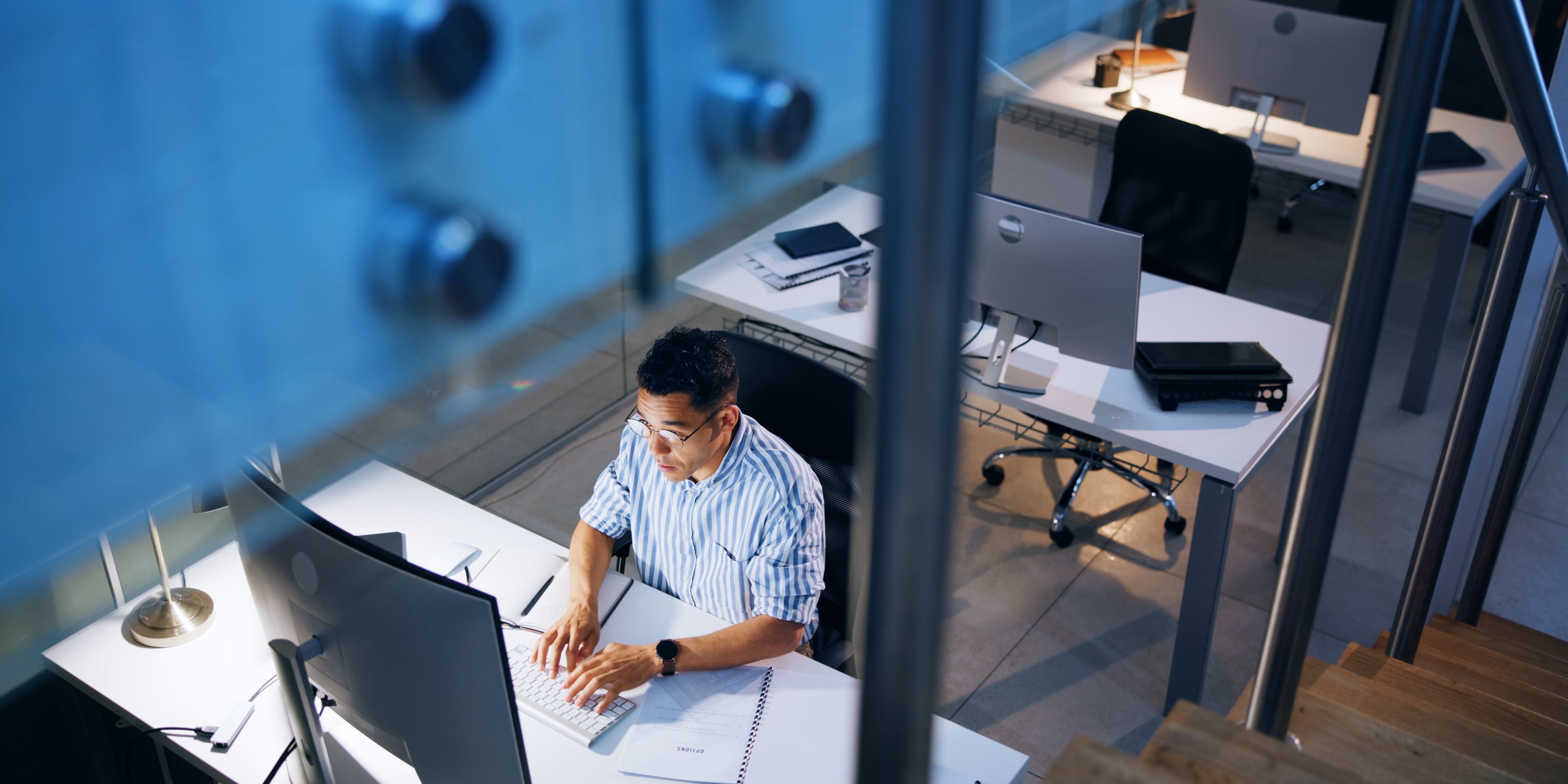 A general assignment reporter writing and organizing his news articles.