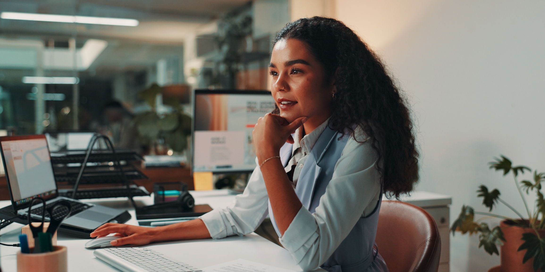 A managing editor on her computer, overseeing the daily flow of news stories.