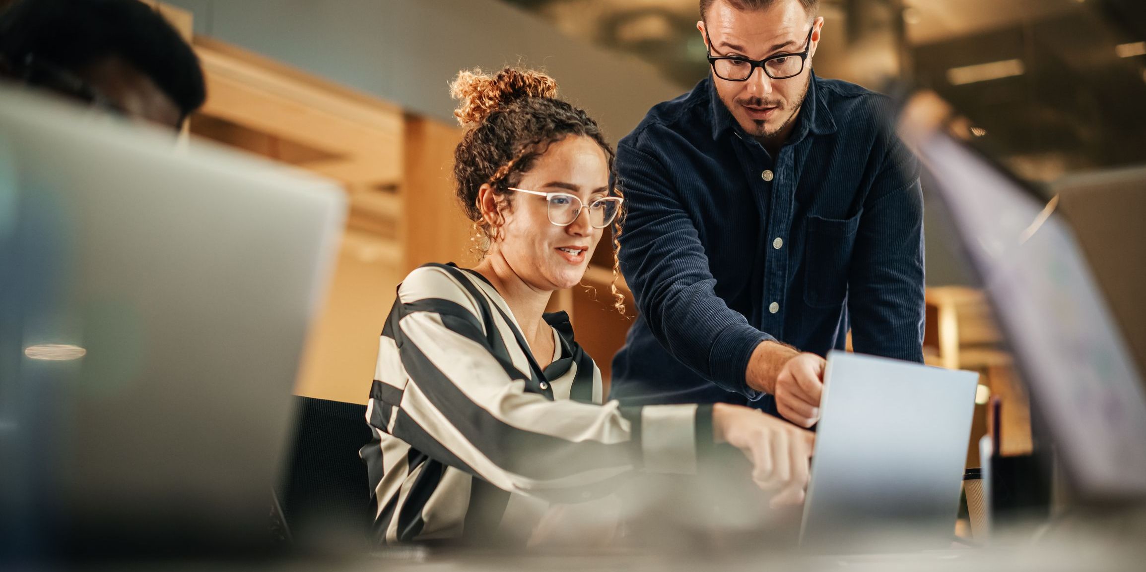 A project coordinator following up with a colleague to make sure a project is running smoothly.