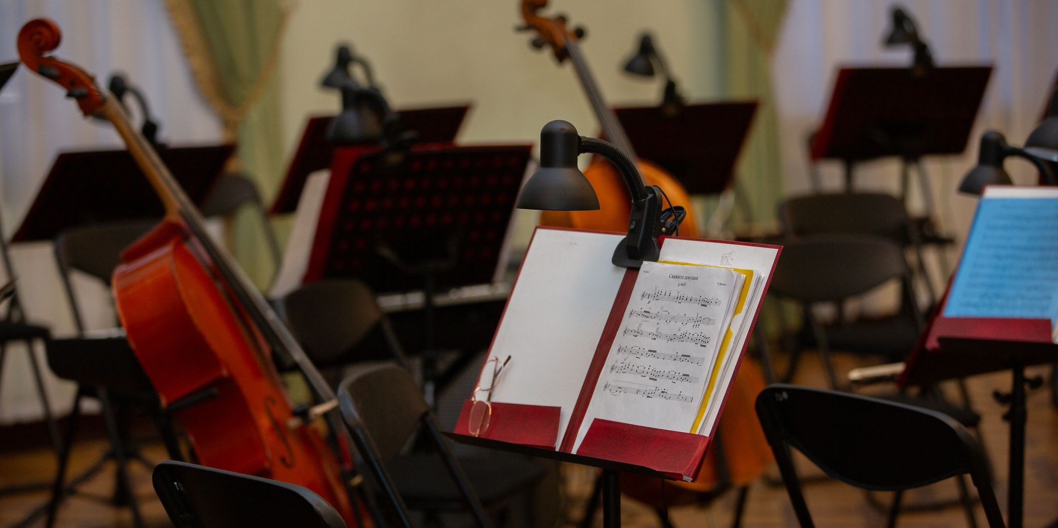 Chamber music setting with music stands and instruments before a performance.