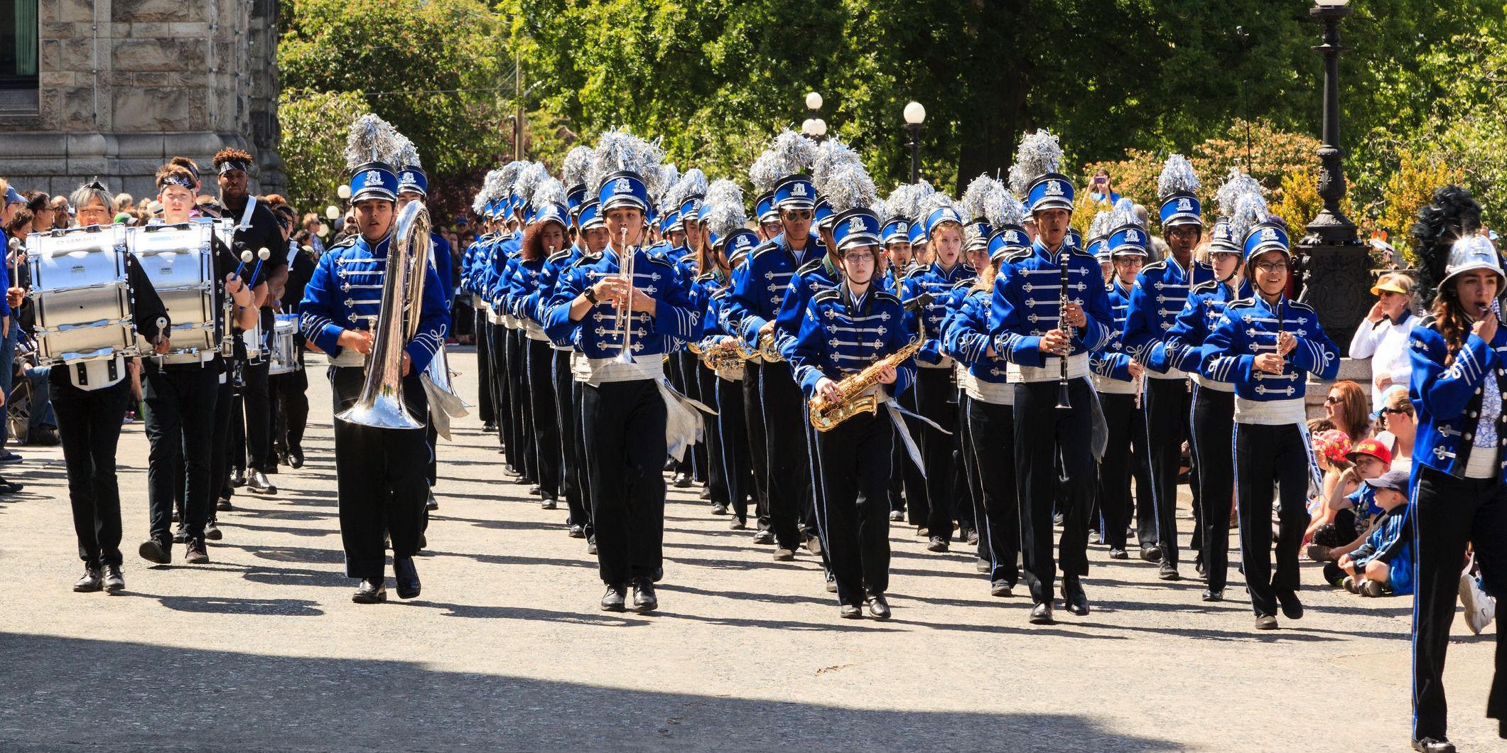 A marching band walking down the street.