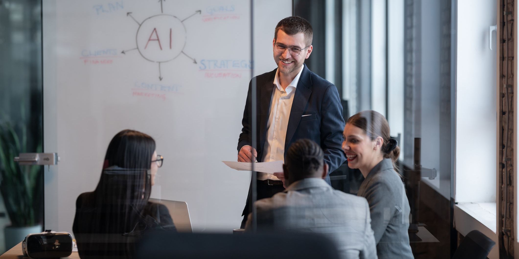 An AI solutions engineer working with a technical team to identify where AI can be used to create helpful solutions.