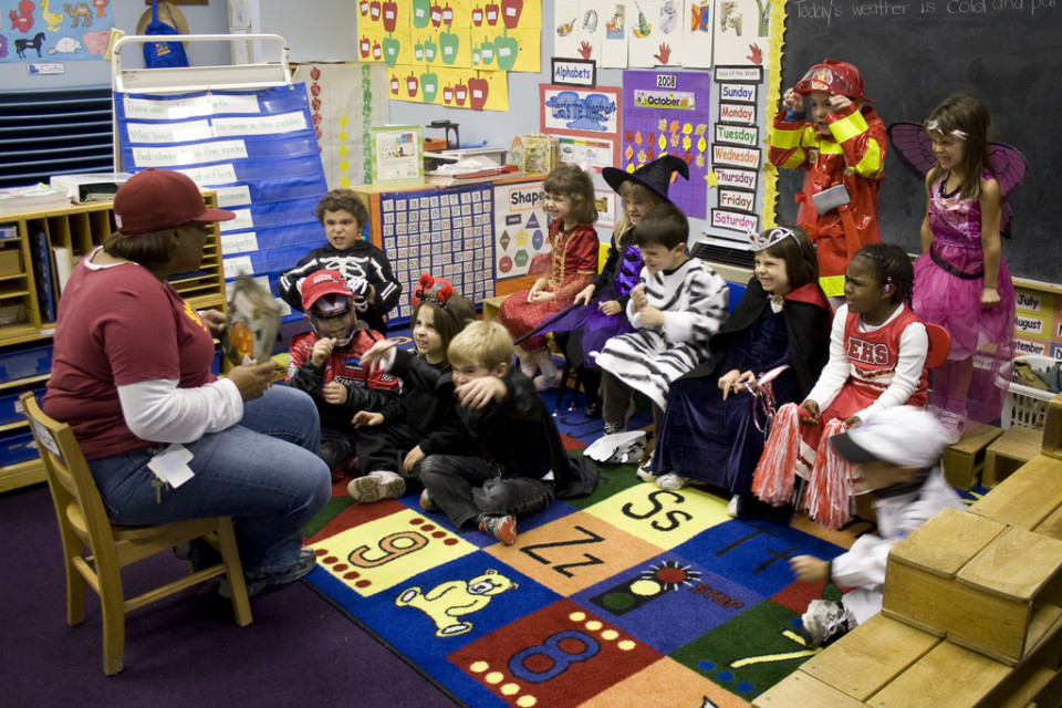 A photo of an elementary school counsellor with her students.