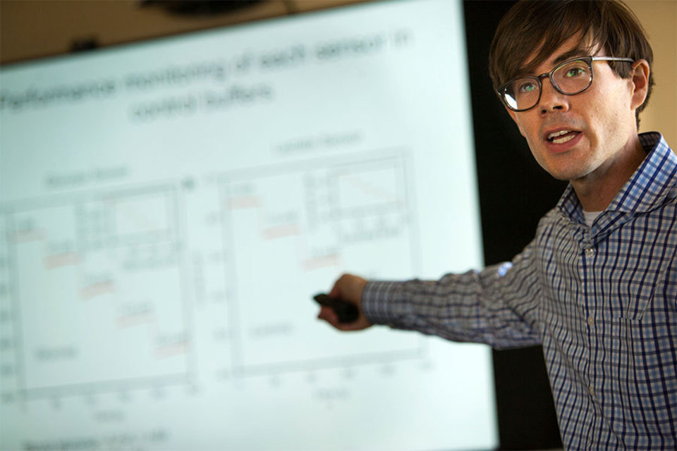 A photo of a research psychologist making a presentation.