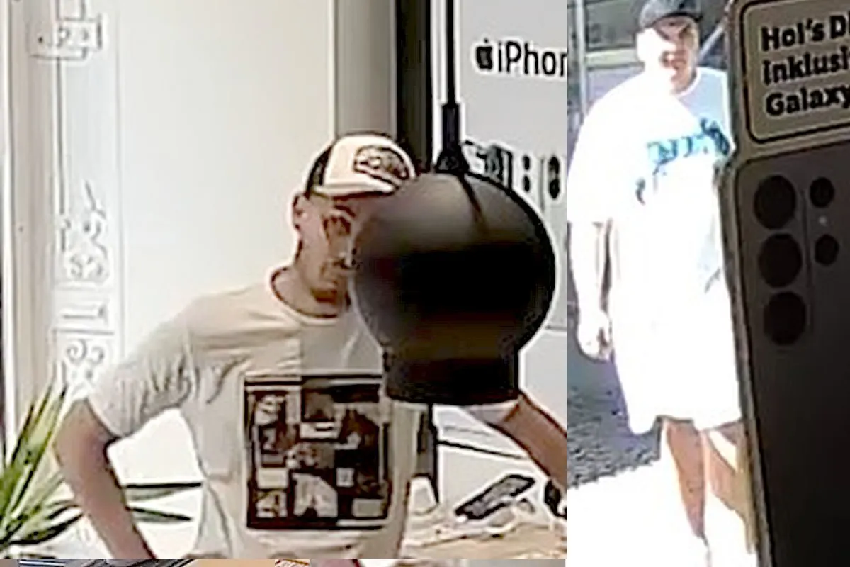 Das Bild zeigt zwei Männer, aufgenommen durch eine Überwachungskamera in einem Geschäft. Einer trägt ein weißes T-Shirt und eine Baseballkappe.