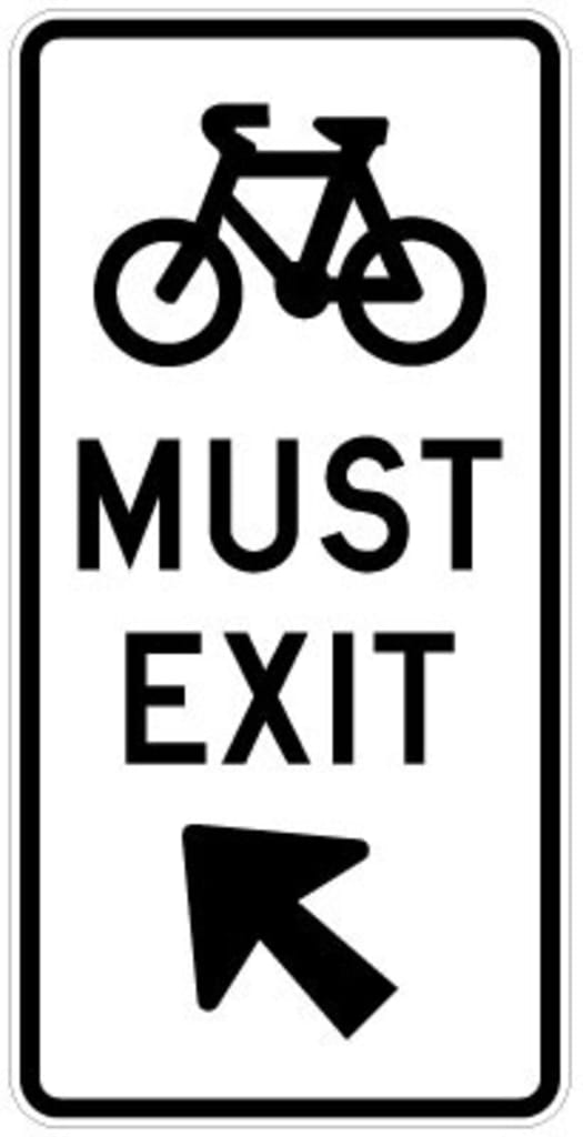 G9-65A Cyclists Must Exit Arrow 600x1200mm