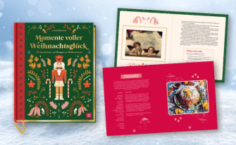 Weihnachtliches Buch 'Momente voller Weihnachtsglück' mit Nussknacker und zwei geöffneten Doppelseiten.