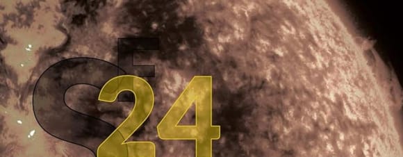 Coverausschnitt aus dem Science Fiction Jahr 2024: zeigt einen nicht näher definierbaren Planeten vom Weltraum aus in grauen farben. Links unten steht SF 24 in großen Buchstaben