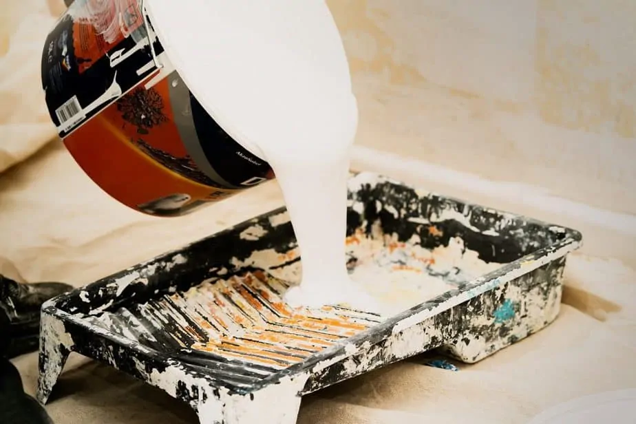 Adding a coat of primer can help your paint stick to the wall and smooth out any imperfections.