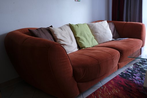 Brown Sofa with Solid Color Throw-Pillows
