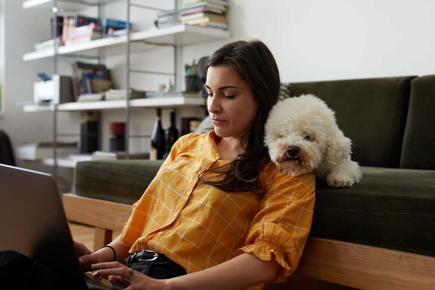 A woman sending a payment reminder email