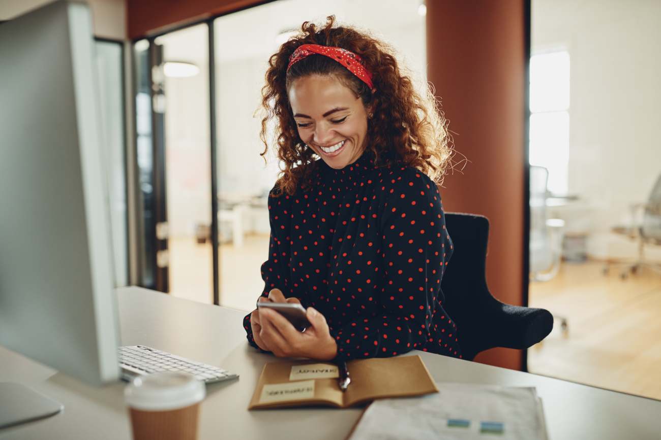 Woman on phone using passive income apps