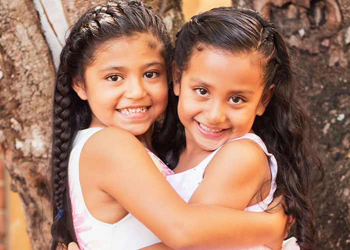 two sisters hugging