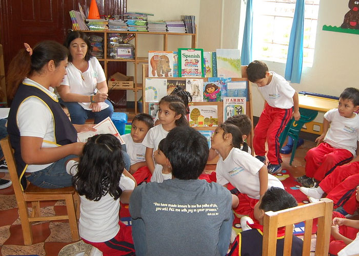 picture of teacher reading to children