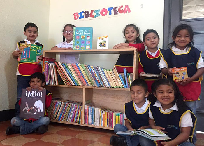 children in front of library