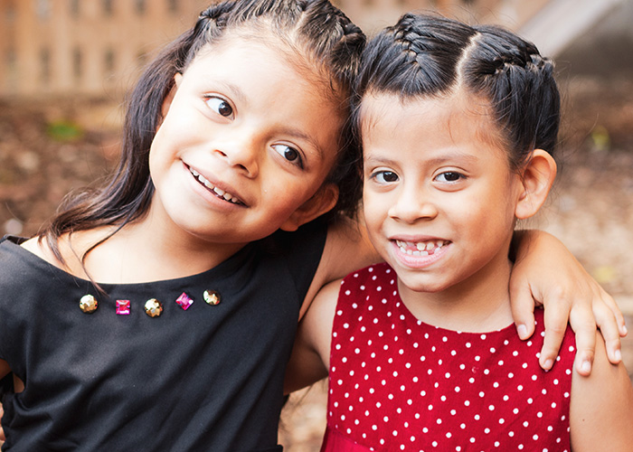 two girls smiling