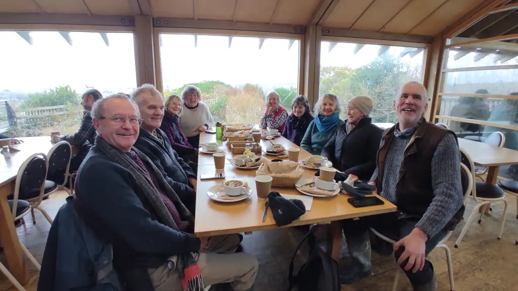 People sat around cafe table