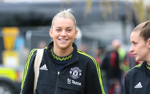 Alessia Russo smiling wearing a Manchester United training top.