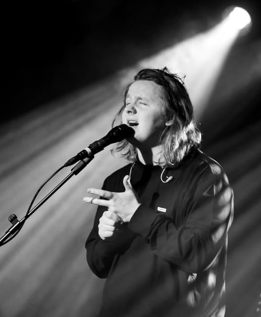 Lewis Capaldi singing at a concert