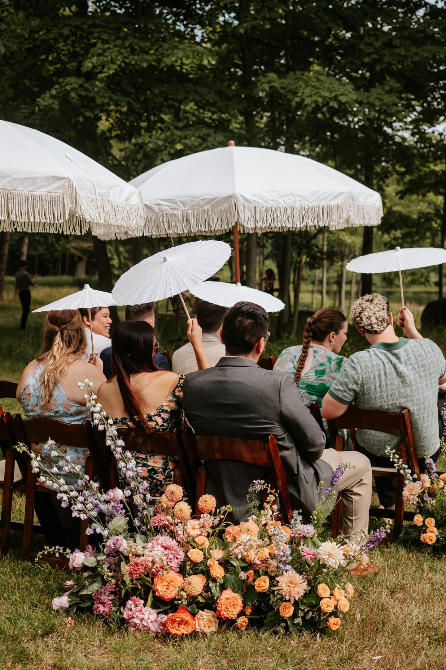 Lakeside ceremony with umbrellas