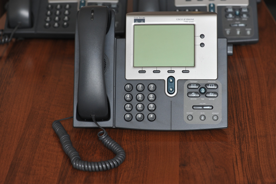 Cisco Work Phone on a Mahogany Desk Cisco Work Phone on a Mahogany Desk