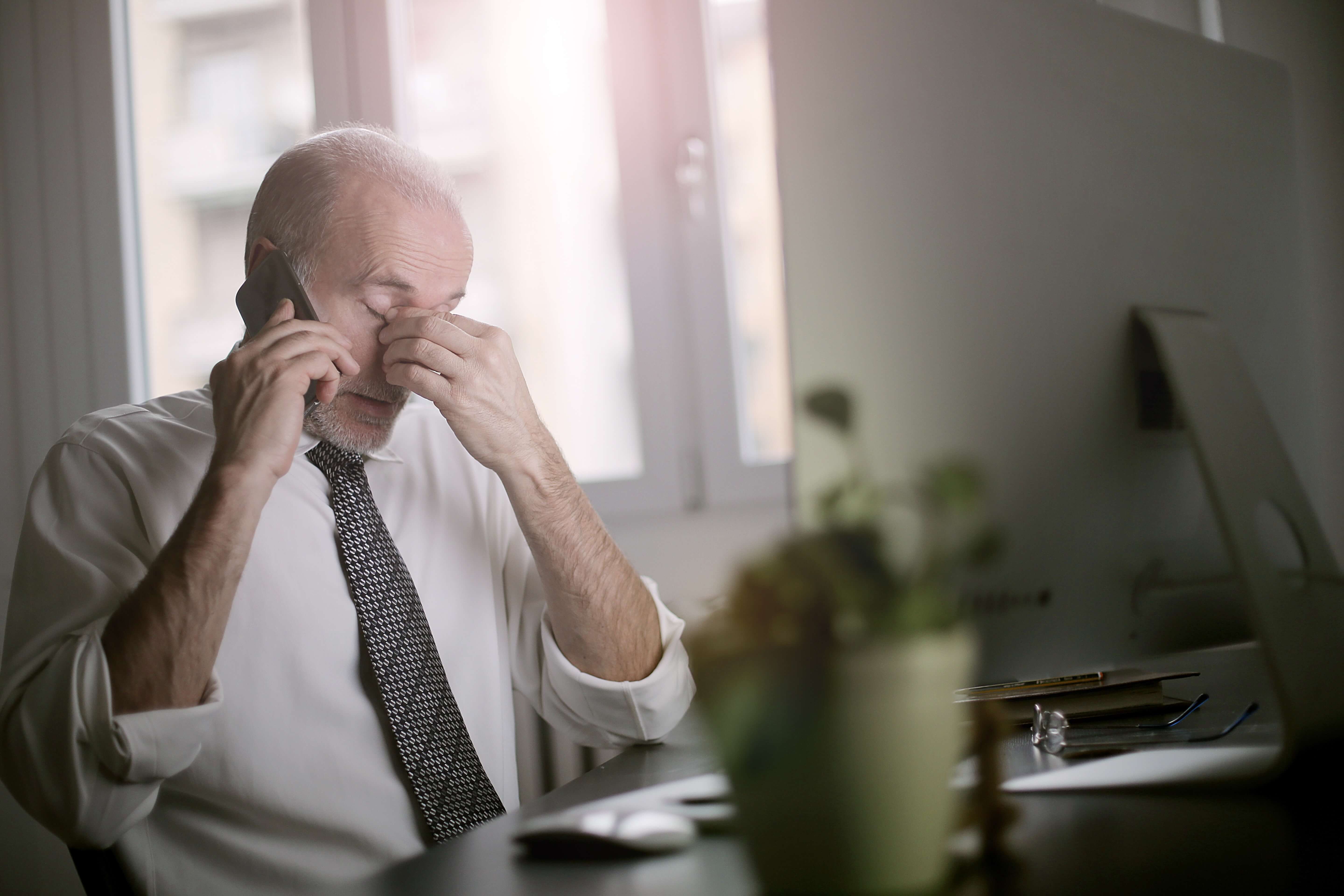 A man annoyed with phone conversation. A man annoyed with phone conversation.