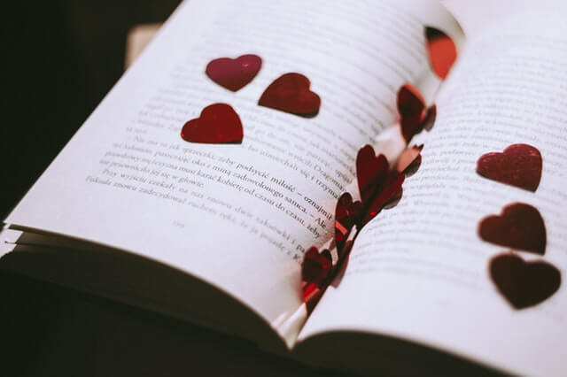 A book with love hearts cut-outs. A book with love hearts cut-outs.