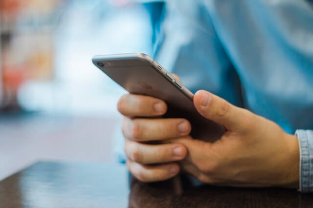 A person on their mobile. A person on their mobile.