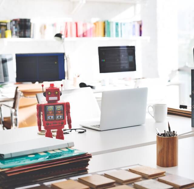 robot on a desk. robot on a desk.
