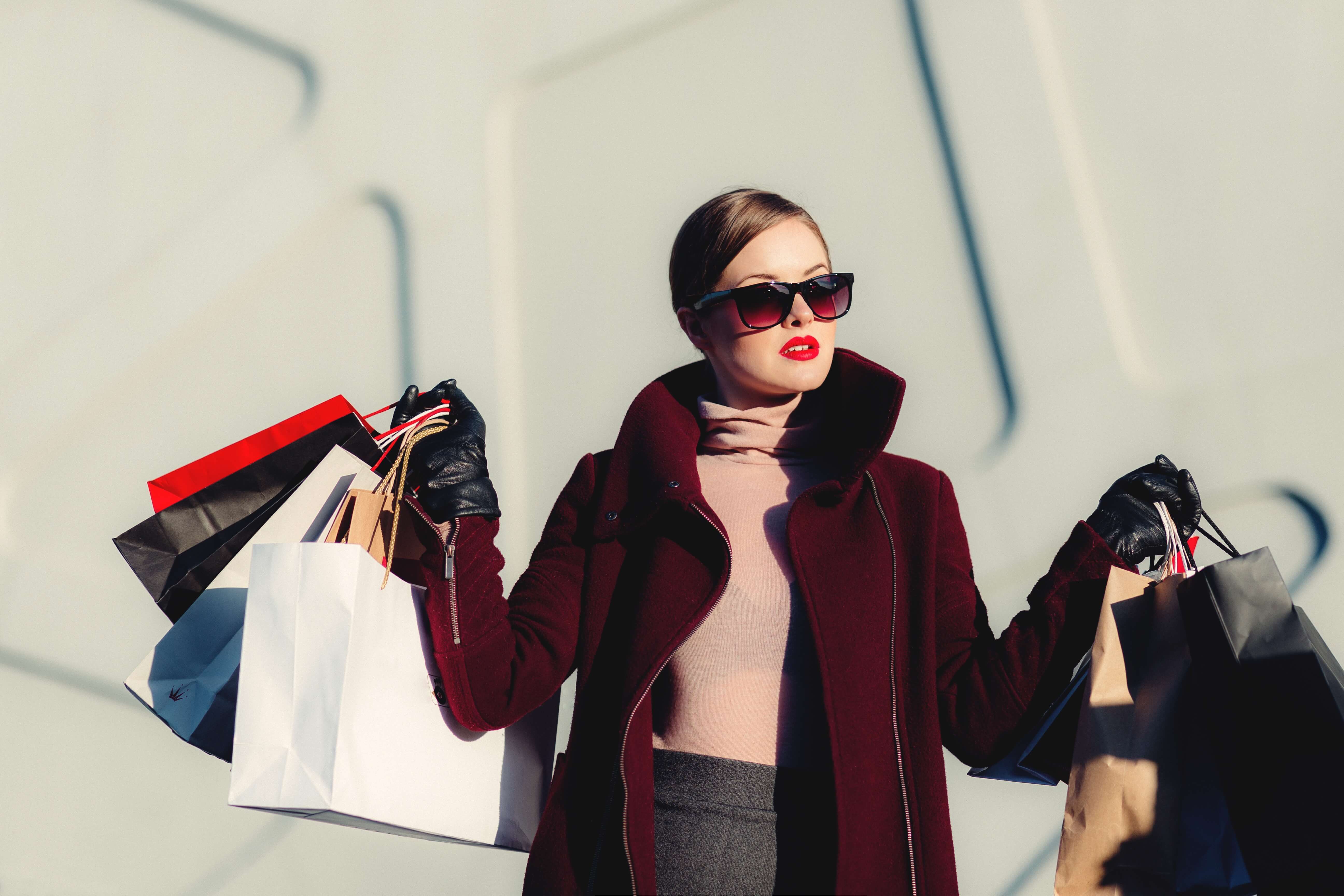 A woman with several shopping bags. A woman with several shopping bags.