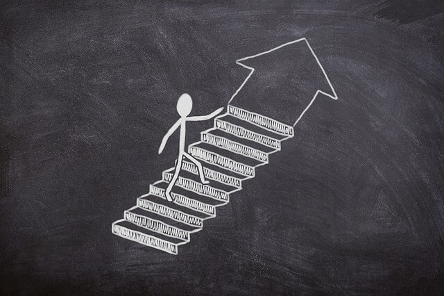 Chalk drawing of person walking up stairs. Chalk drawing of person walking up stairs.