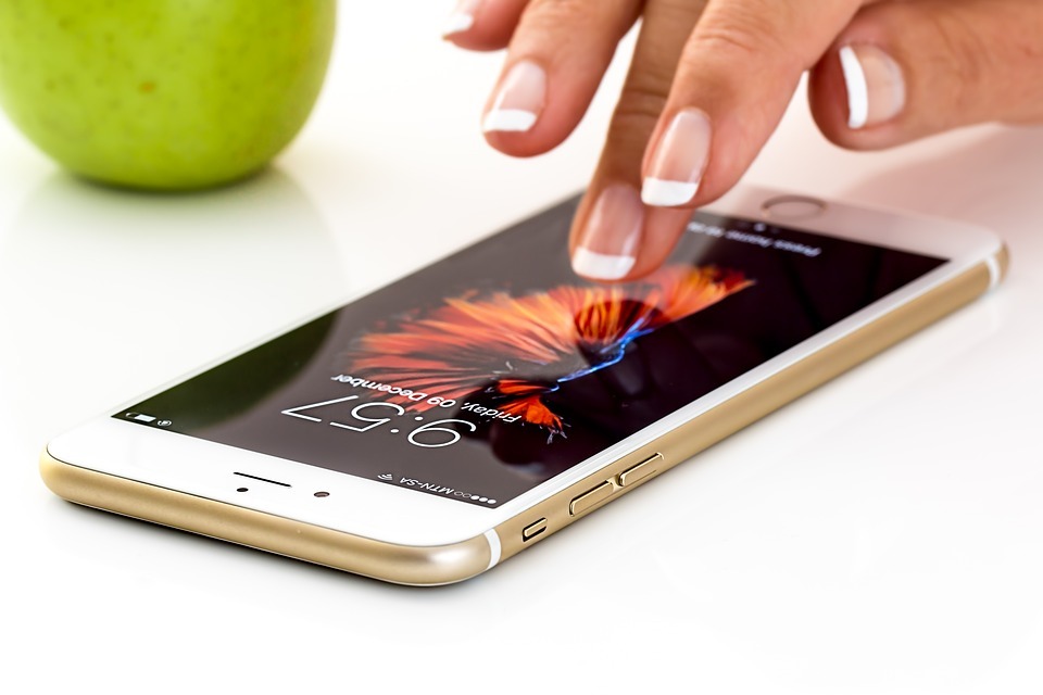 Someone using an Apple iPhone Someone using an Apple iPhone