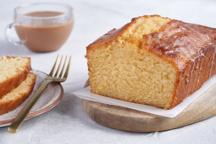 Lemon drizzle loaf cake with a cup of tea