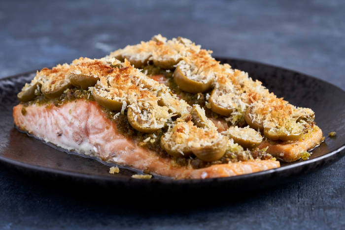 Salmon fillets topped with pesto breadcrumbs and olives