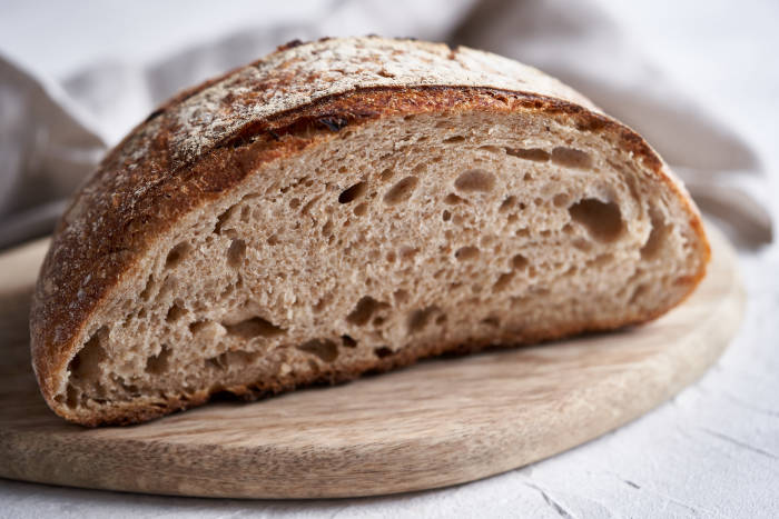 70% hydration sourdough boule cut in half
