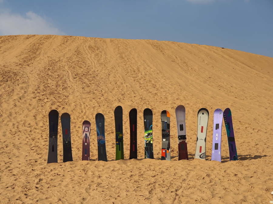 Sand surfing, surf on a dune with a board!