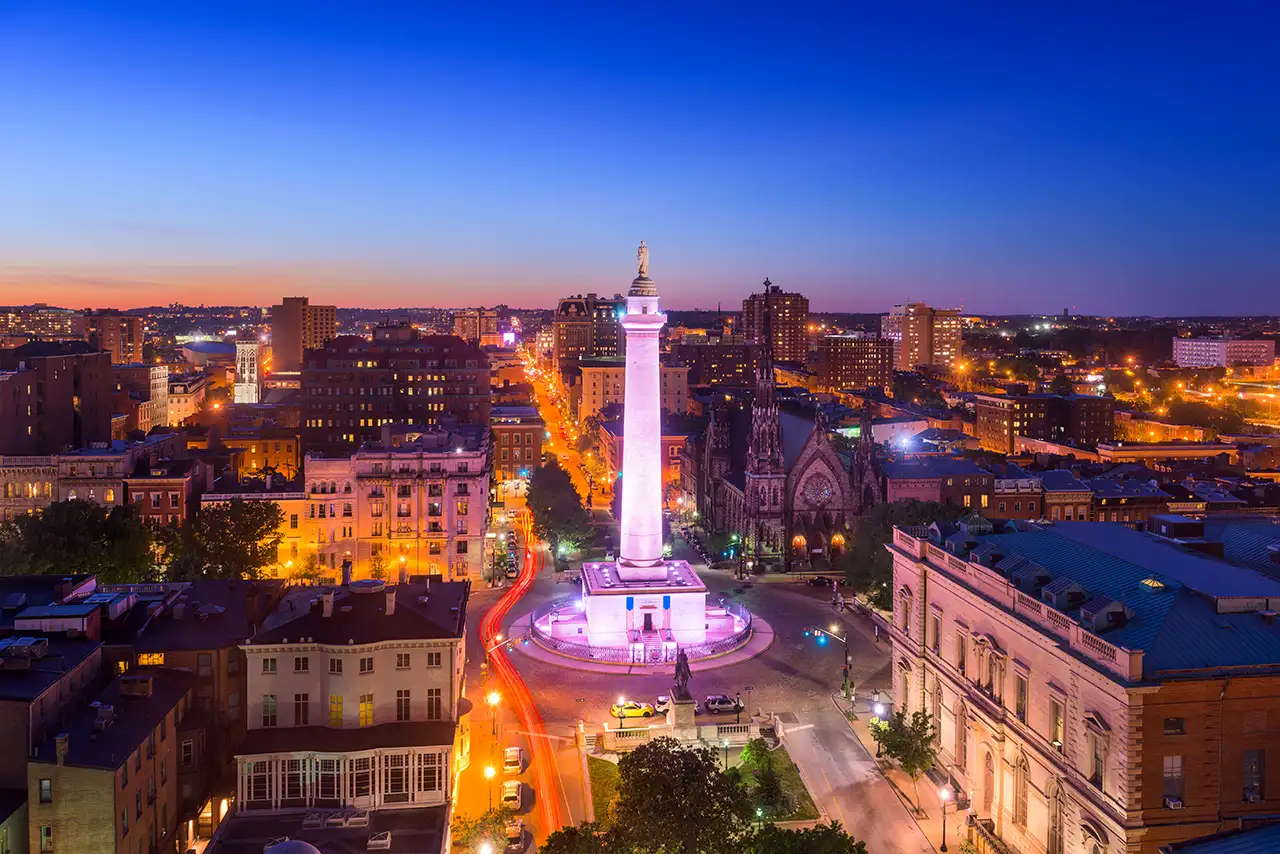 Beautiful shot of lighted Washington Monument in Mt. Vernon Place in downtown Baltimore Maryland at dusk