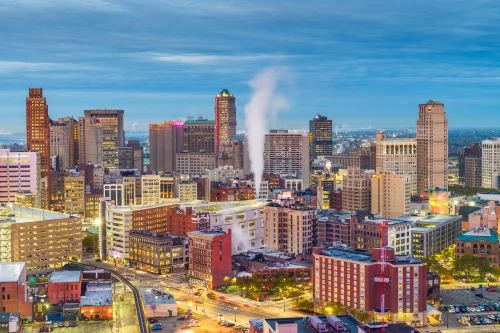Detroit skyline and Midwest real estate market spanning city neighborhoods and surrounding suburban areas