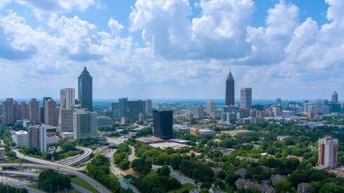 Georgia skyline and statewide real estate market spanning Atlanta suburbs and growing regional communities